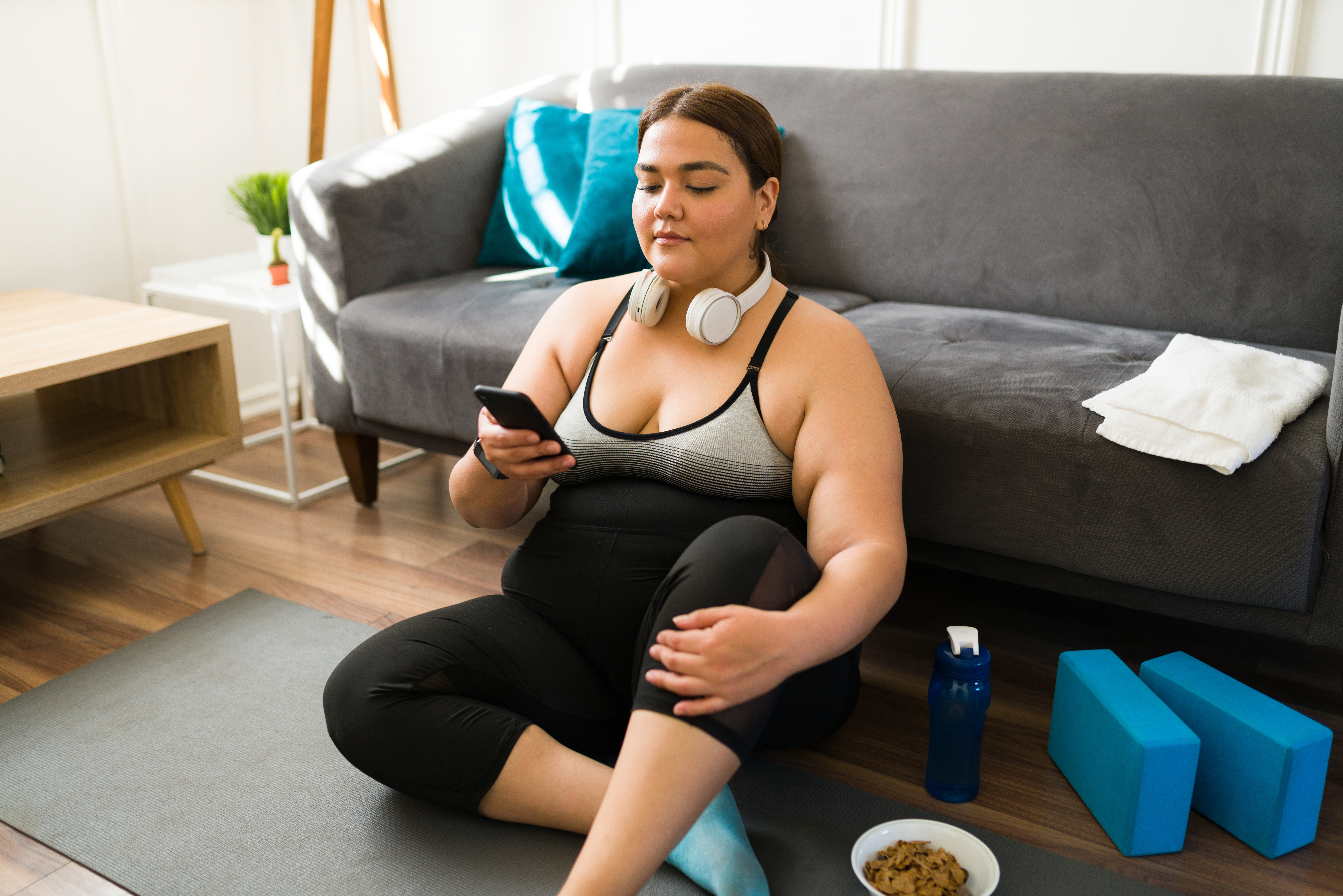 Patient using mobile app for wellness tracking after exercise
